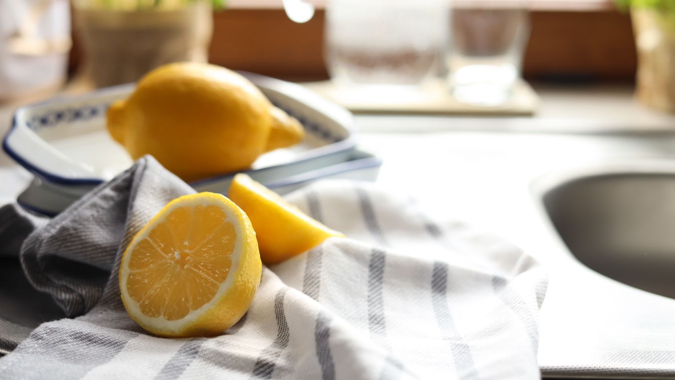 Fresh,Ripe,Lemons,On,Countertop,In,Kitchen,,Closeup.,Space,For