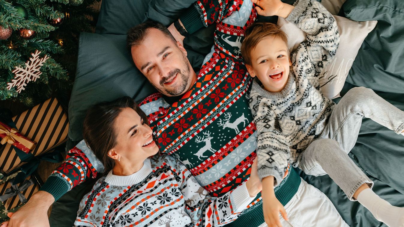 Happy,Family,Near,Fir-tree,In,Bedroom,,Christmas,Celebration,At,Home