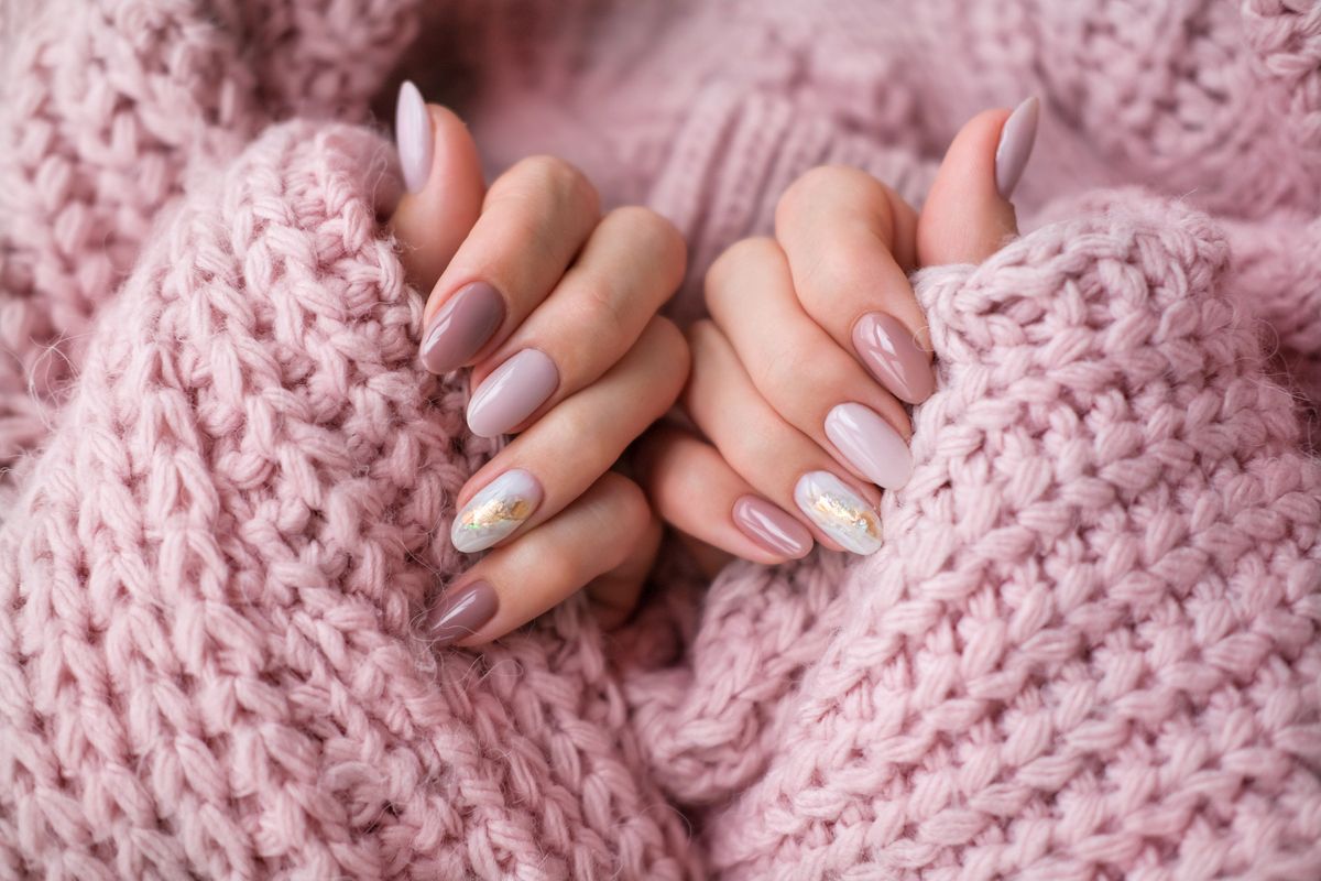 Women's,Hands,With,A,Beautiful,Oval,Manicure,In,A,Warm