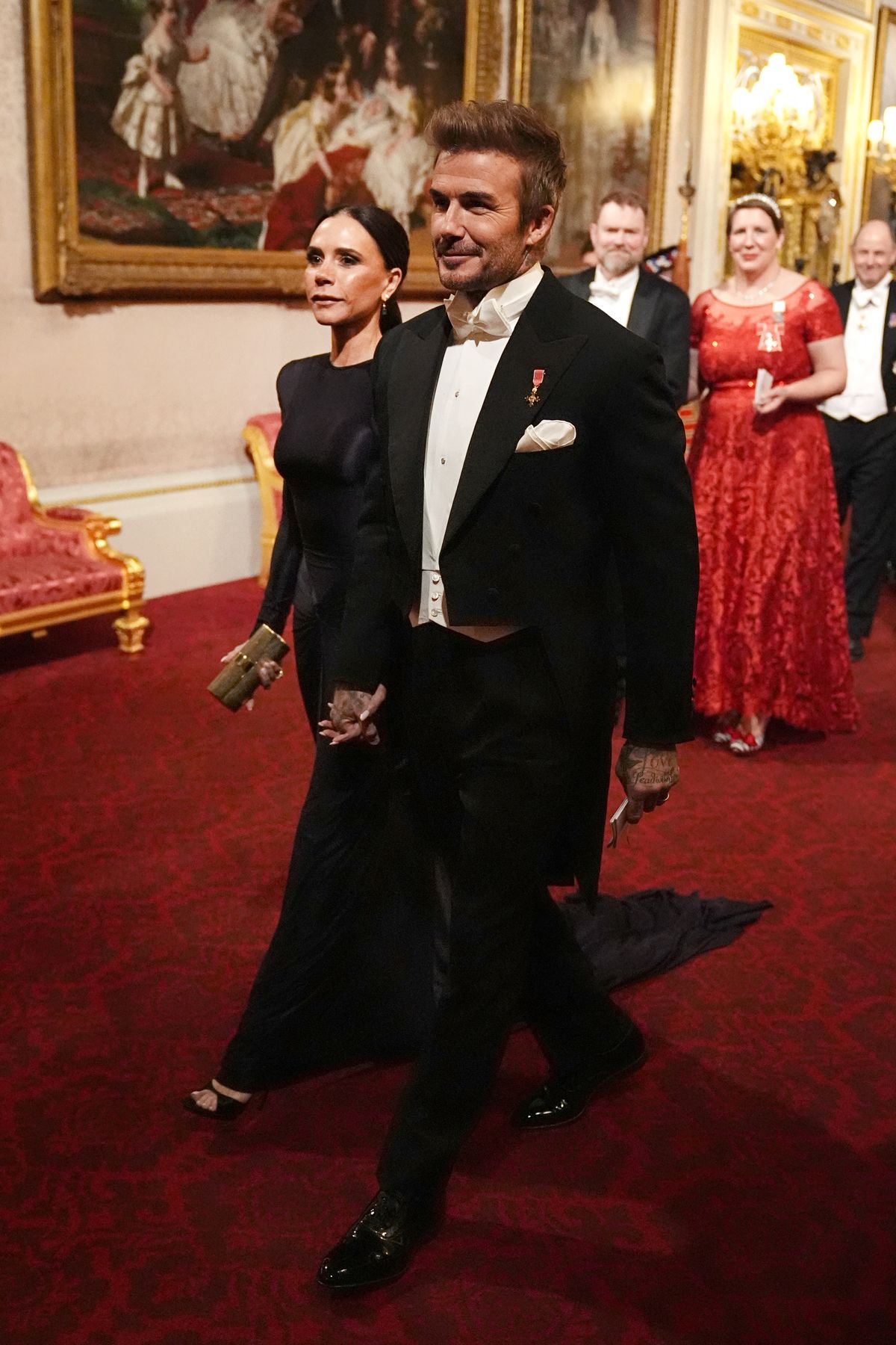 Victoria Beckham és David Beckham a Buckingham palotában