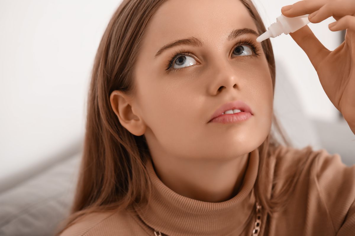 Young,Woman,Using,Eye,Drops,At,Home,,Closeup