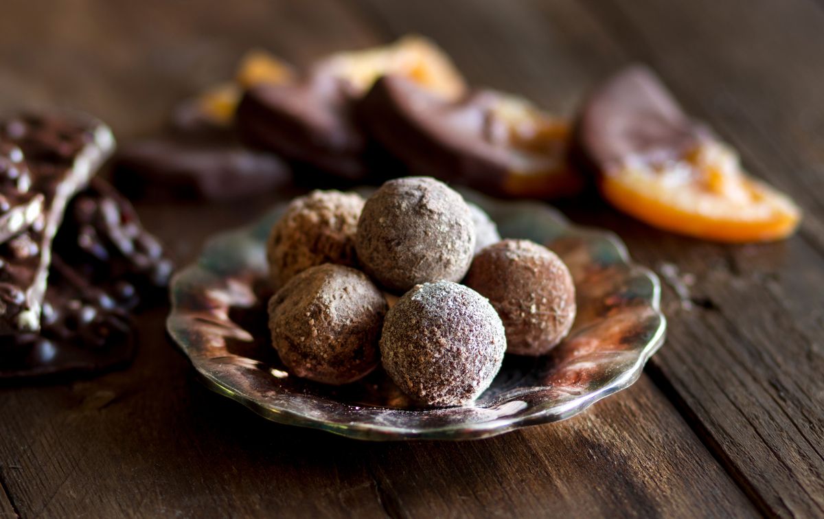 Chocolate,,Truffles,And,Orange,Slices,In,Dark,Chocolate,On,A