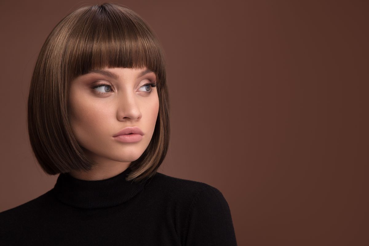 Portrait,Of,A,Beautiful,Brown-haired,Woman,With,A,Short,Haircut