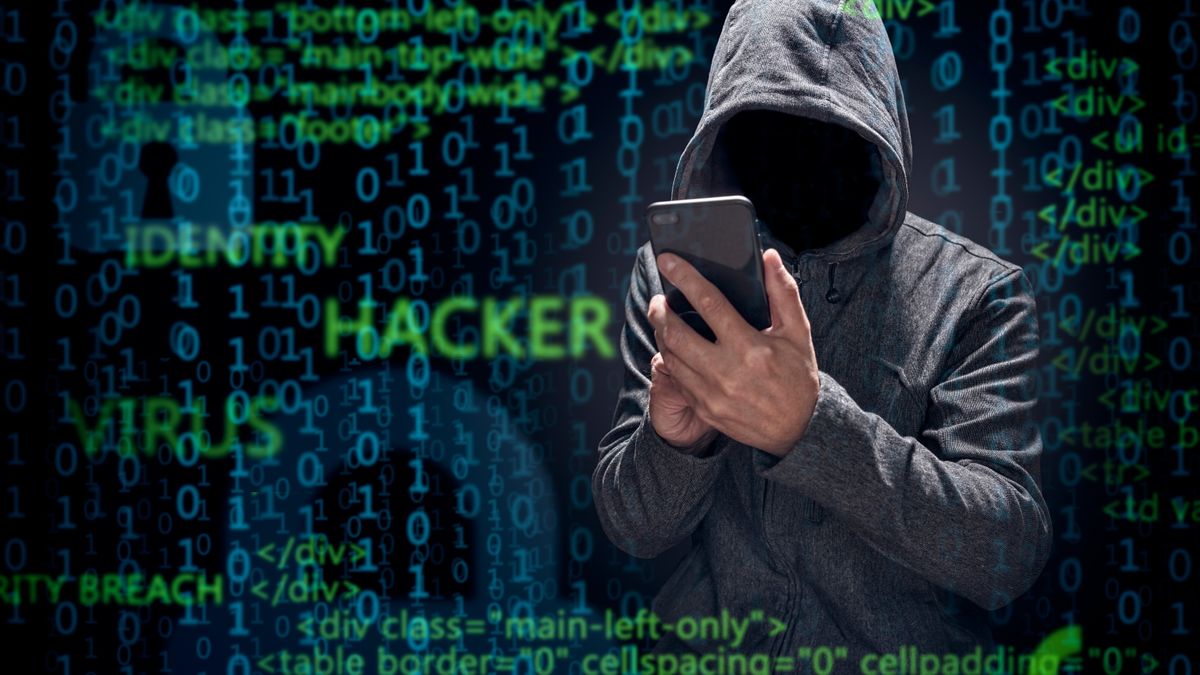 Computer,Hacker,With,Mobile,Phone,Smartphone,Stealing,Data