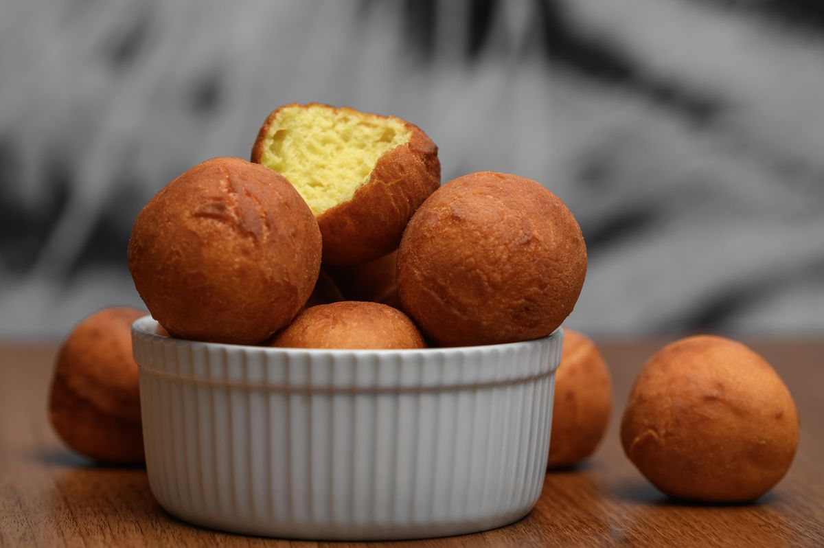 Mini,Donuts,Spill,Out,Of,The,Bowl,,Delicious,Fried,Donuts