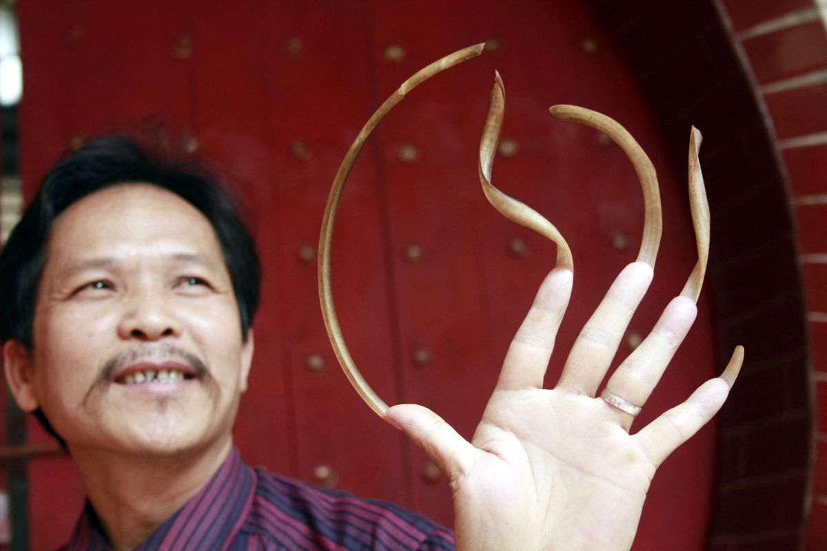 Man in S China grows 20cm long fingernails