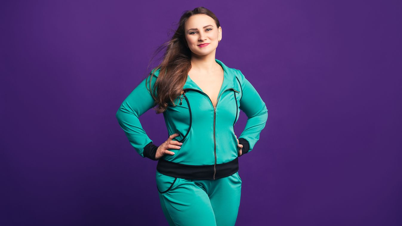 Happy,Plus,Size,Model,In,Tracksuit,,Fat,Woman,On,Purple