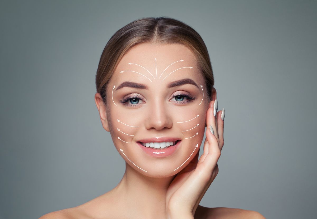 Happy woman. Face lift anti-aging lines on young female face. Graphic lines showing facial lifting effect on skin. Plastic surgery, cosmetology and massage concept, botox helyett