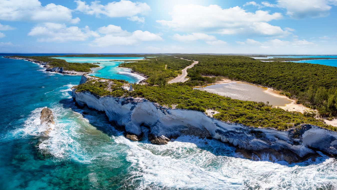 Panoramic aerial view of the north cape of Long Island, The Bahamas, with the famous Columbus monument on a cliff reaching out into the turquoise sea