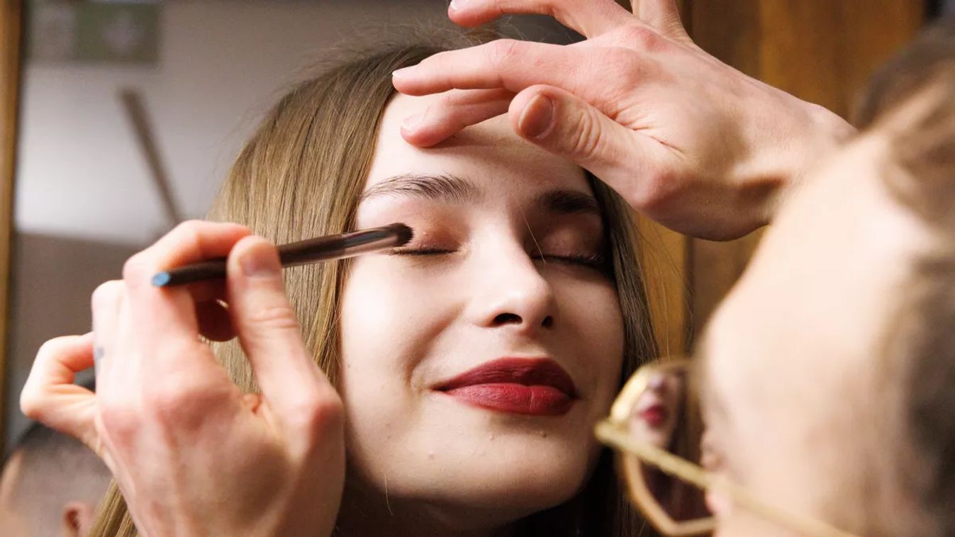MILAN, ITALY - MARCH 01: Makeup artist applies makeup to a model backstage at the Luisa Spagnoli fashion show during the Milan Fashion Week - Womenswear Fall/Winter 2025/2026 on March 01, 2025 in Milan, Italy. (Photo by Rosdiana Ciaravolo/Getty Images)