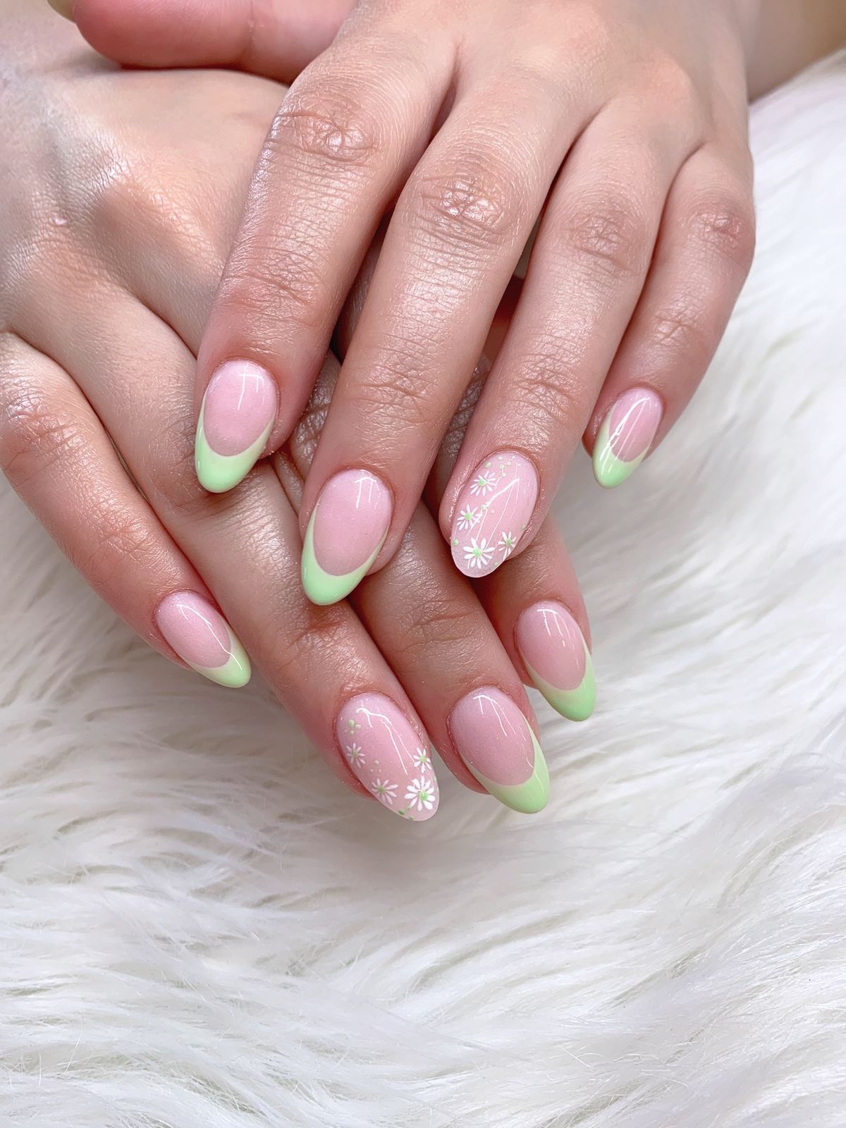 Cute pastel green French tip nails with pink base color