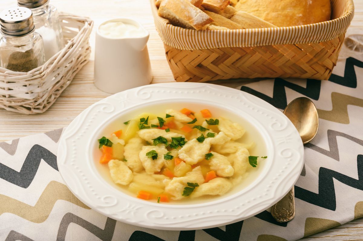 Soup with dumplings on white background. levesbetét
