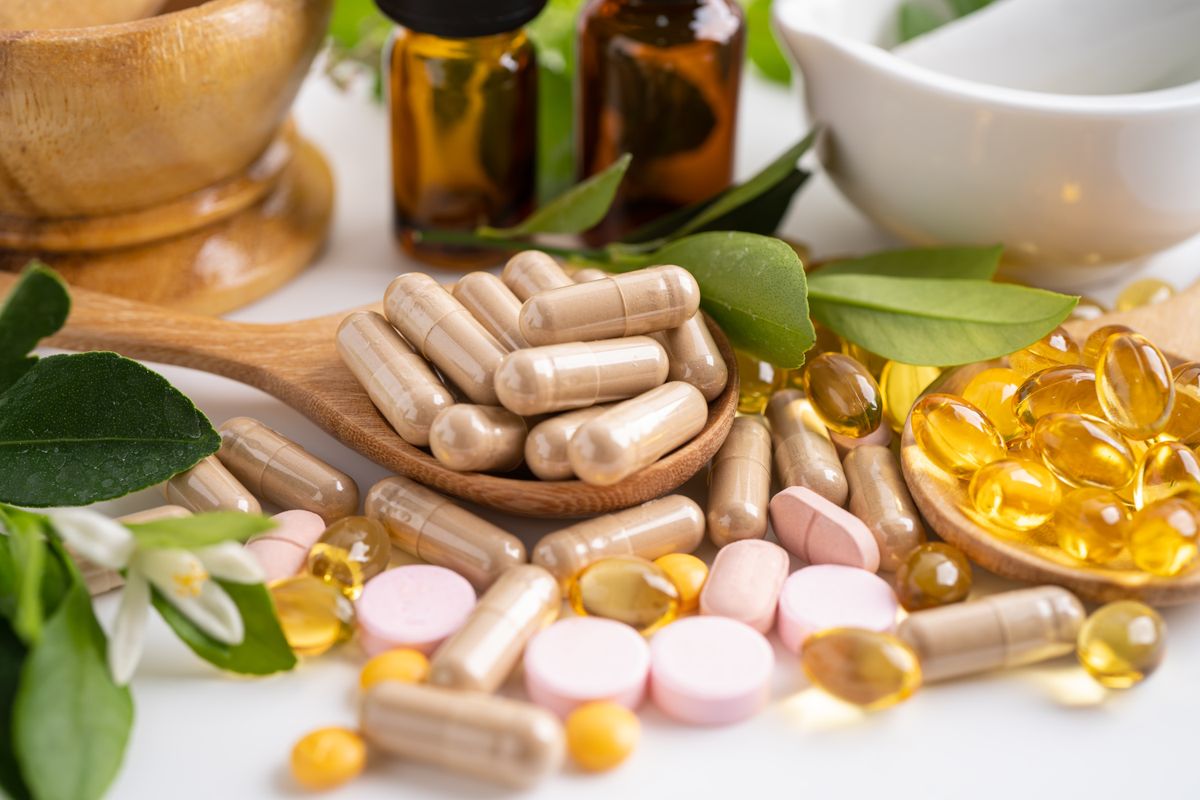Alternative medicine herbal organic capsule with vitamin E omega 3 fish oil, mineral, drug with herbs leaf natural supplements for healthy good life.