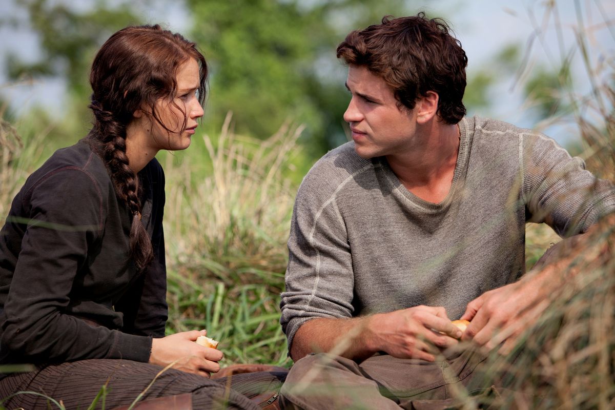 Katniss Everdeen (Jennifer Lawrence) and Gale Hawthorne (Liam Hemsworth) in THE HUNGER GAMES.
