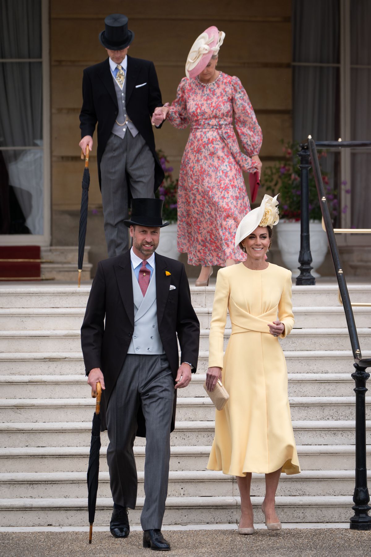 LONDON, ENGLAND - MAY 20: Prince William, Prince of Wales and Catherine, Princess of Wales walk down the steps followed by Duke and Duchess of Edinburgh at the start of a Royal Garden Party at Buckingham Palace on May 20, 2025 in London, England. (Photo by Aaron Chown - WPA Pool / Getty Images)