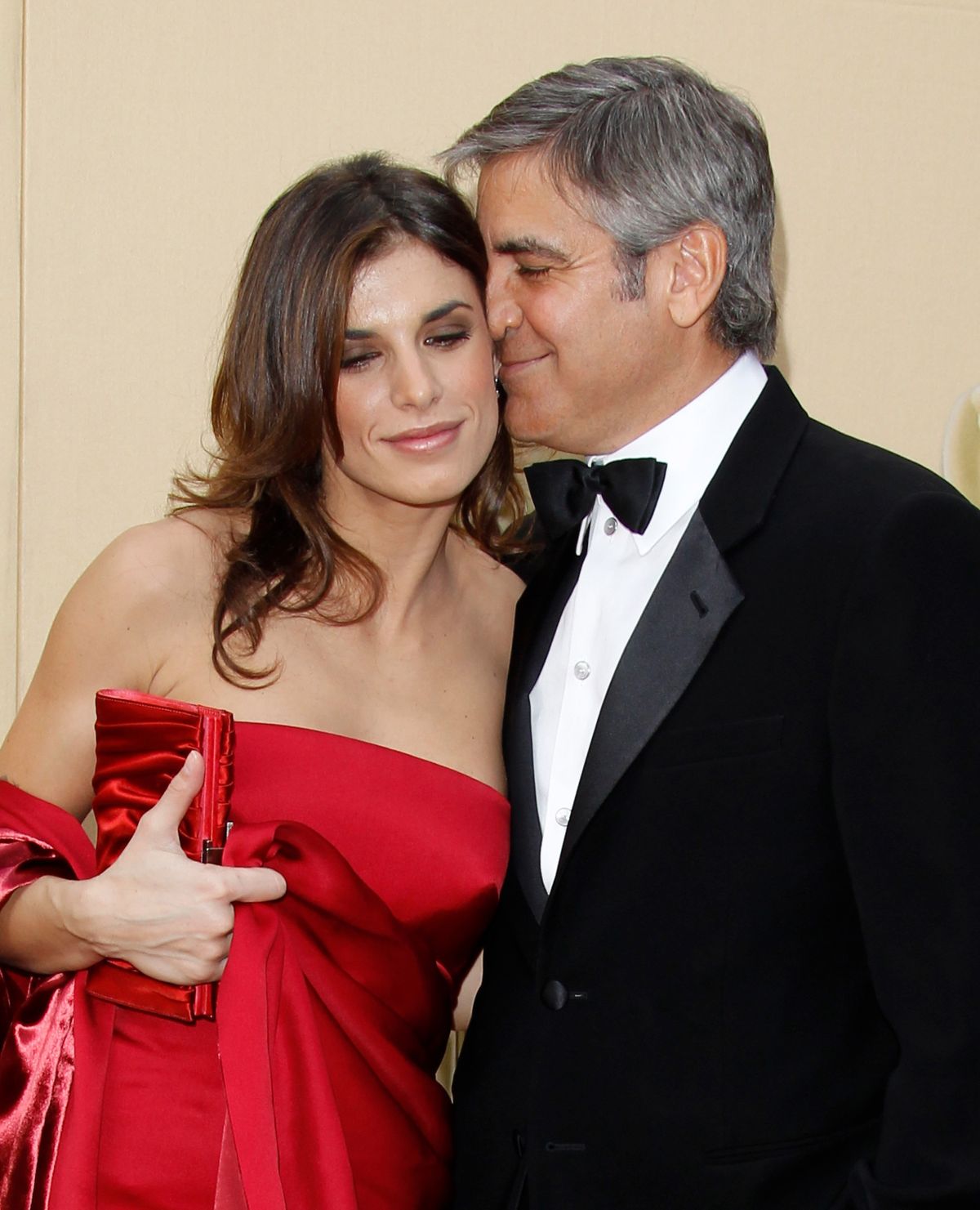 HOLLYWOOD - MARCH 07:  Actor George Clooney (R) and Elisabeth Canalis attend the 82nd Annual Academy Awards held at the Kodak Theater on March 7, 2010 in Hollywood, California. (Photo by Dan MacMedan/WireImage)