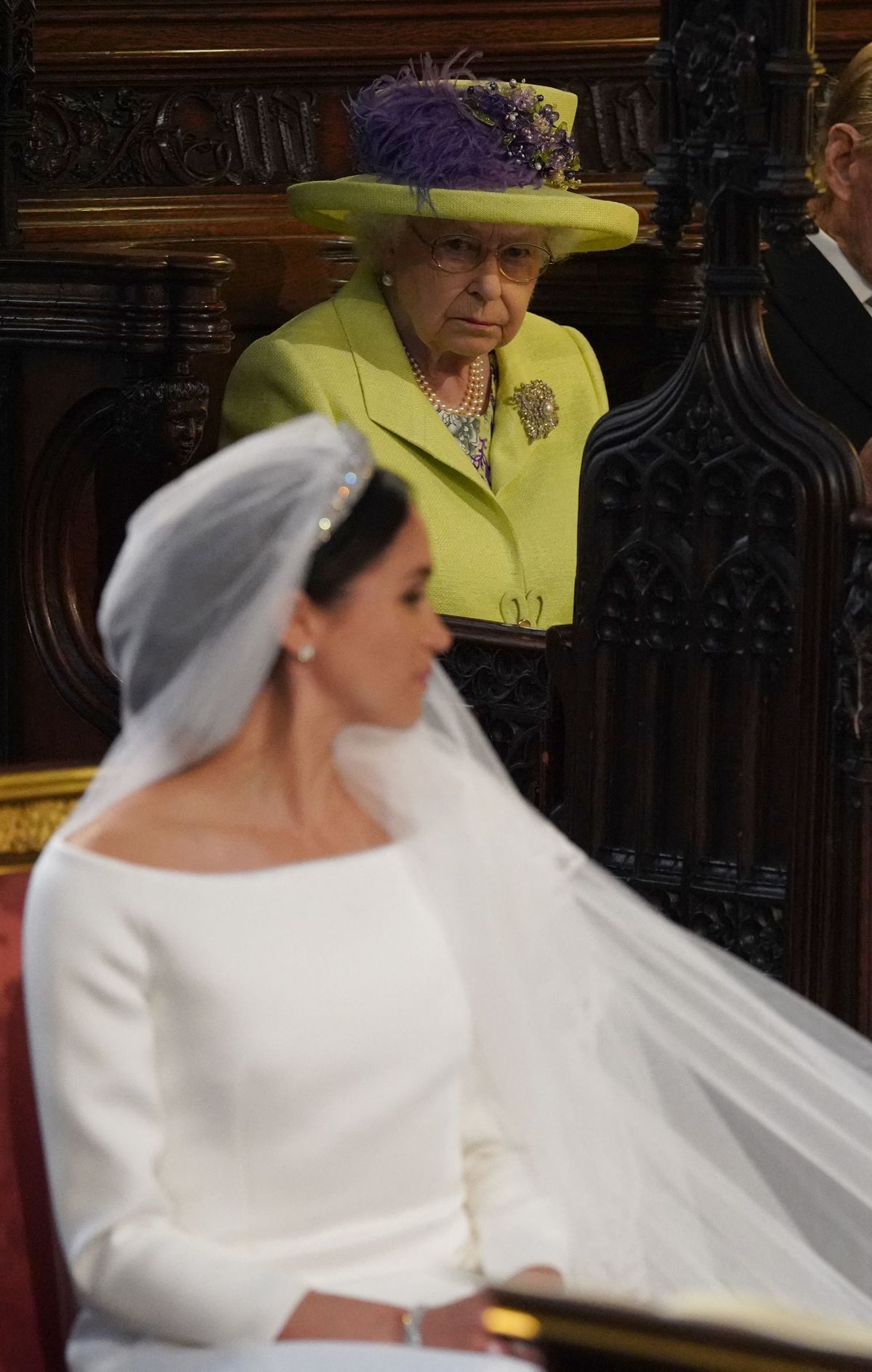 Britain's Queen Elizabeth II looks on during the wedding ceremony of Britain's Prince Harry, Duke of Sussex and US actress Meghan Markle in St George's Chapel, Windsor Castle, in Windsor, on May 19, 2018. (Photo by Jonathan Brady / POOL / AFP)