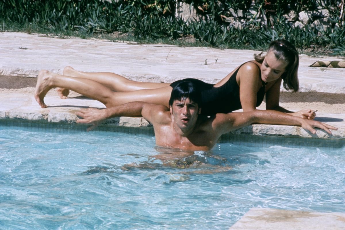 French actor Alain Delon and Austrian-born German actress Romy Schneider on the set of La Piscine, directed by Jacques Deray. (Photo by Alain Dejean/Sygma via Getty Images)
