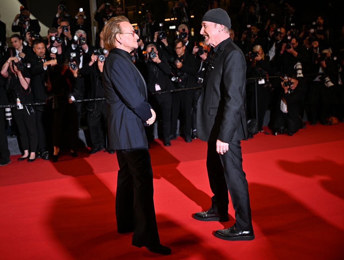CANNES, FRANCE - MAY 16: Irish singer-Songwriter and executive producer Bono (L) and British-Irish musician The Edge (R) arrive for the screening 'Bono: Stories of Surrender' at the 78th edition of the Cannes Film Festival in Cannes, France, on May 16, 2025. (Photo by Mustafa Yalcin/Anadolu via Getty Images)