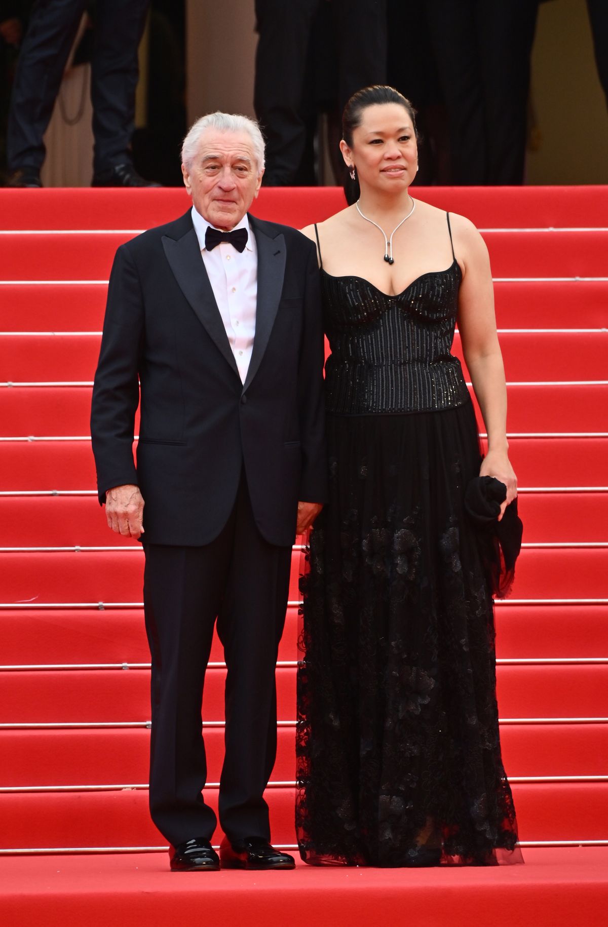 CANNES, FRANCE - MAY 13: Robert De Niro (L) and Tiffany Chen attend the Opening Ceremony screening of "Partir Un Jour" (Leave One Day)" during The 78th Annual Cannes Film Festival at Palais des Festivals on May 13, 2025 in Cannes, France. (Photo by Jed Cullen/Dave Benett/WireImage)