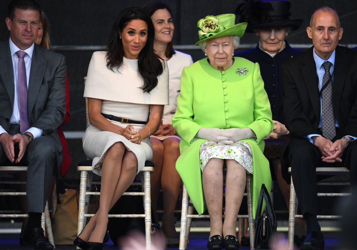 WIDNES, ENGLAND - JUNE 14:  Queen Elizabeth II sits with Meghan, Duchess of Sussex Sussex accompanied by Samantha Cohen (Back, C, L) during a ceremony to open the new Mersey Gateway Bridge on June 14, 2018 in the town of Widnes in Halton, Cheshire, England. Meghan Markle married Prince Harry last month to become The Duchess of Sussex and this is her first engagement with the Queen. During the visit the pair will open a road bridge in Widnes and visit The Storyhouse and Town Hall in Chester.  (Photo by Jeff J Mitchell/Getty Images)