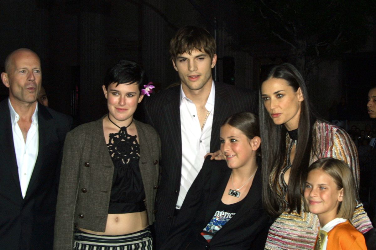 UNITED STATES - JUNE 18:  Demi Moore with boyfriend Ashton Kutcher, ex-husband Bruce Willis and their daughters arriving for the premiere of "Charlie's Angeles at Mannn's Chinese Theater in Hollywood, CA 06/18/03  (Photo by Vinnie Zuffante/Getty Images)