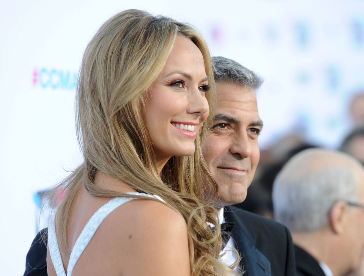 HOLLYWOOD, CA - JANUARY 12:  Actor/Director George Clooney (R) and actress Stacy Keibler arrive at the 17th Annual Critics' Choice Movie Awards held at The Hollywood Palladium on January 12, 2012 in Los Angeles, California.  (Photo by Jason Merritt/Getty Images)
