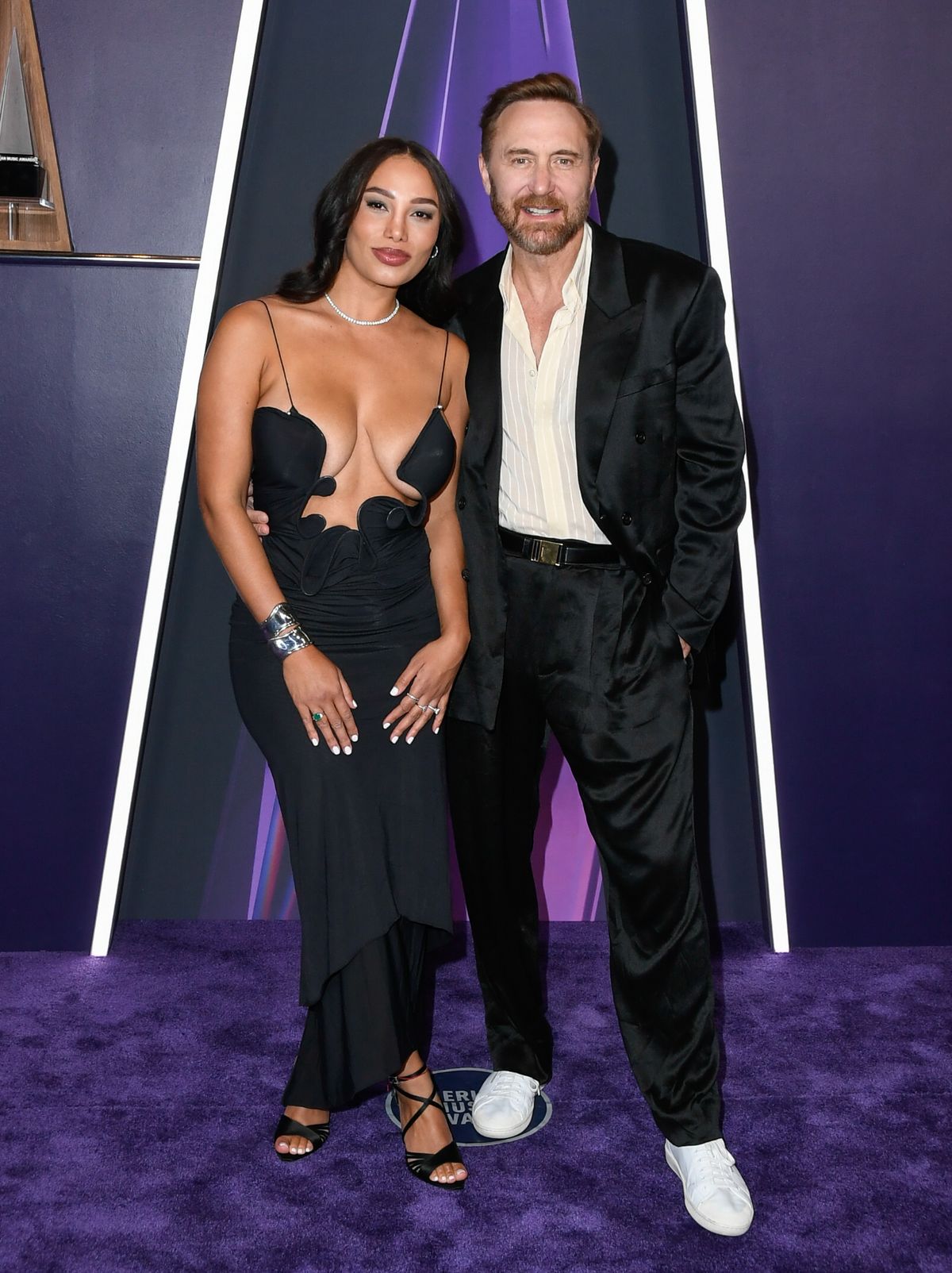 LAS VEGAS, NEVADA - MAY 26: EDITORIAL USE ONLY Jessica Ledon (L) and David Guetta arrive at the 2025 American Music Awards at Fontainebleau Las Vegas on May 26, 2025 in Las Vegas, Nevada. (Photo by Mindy Small/FilmMagic)