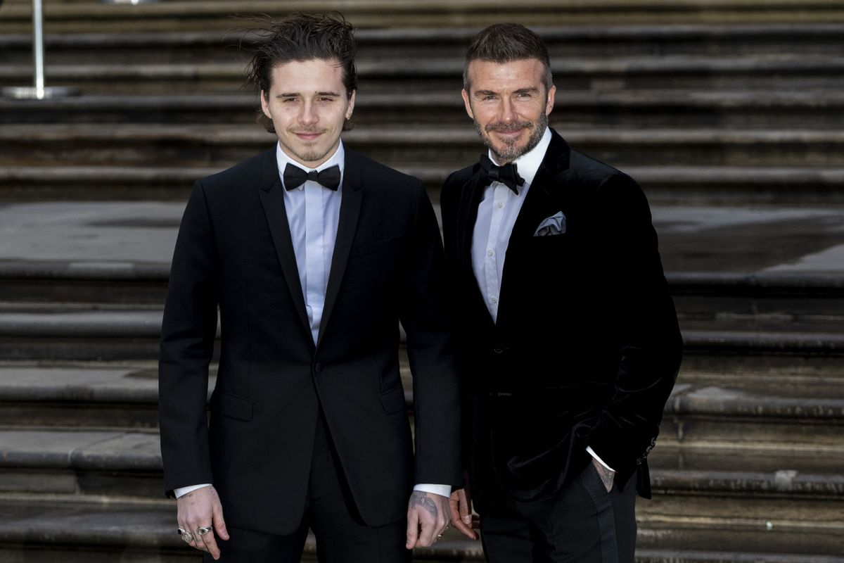 Former England footballer David Beckham (R) and his son Brooklyn pose on arrival for the Global Premiere of "Our Planet" in London on April 4, 2019. (Photo by Niklas HALLE'N / AFP)
