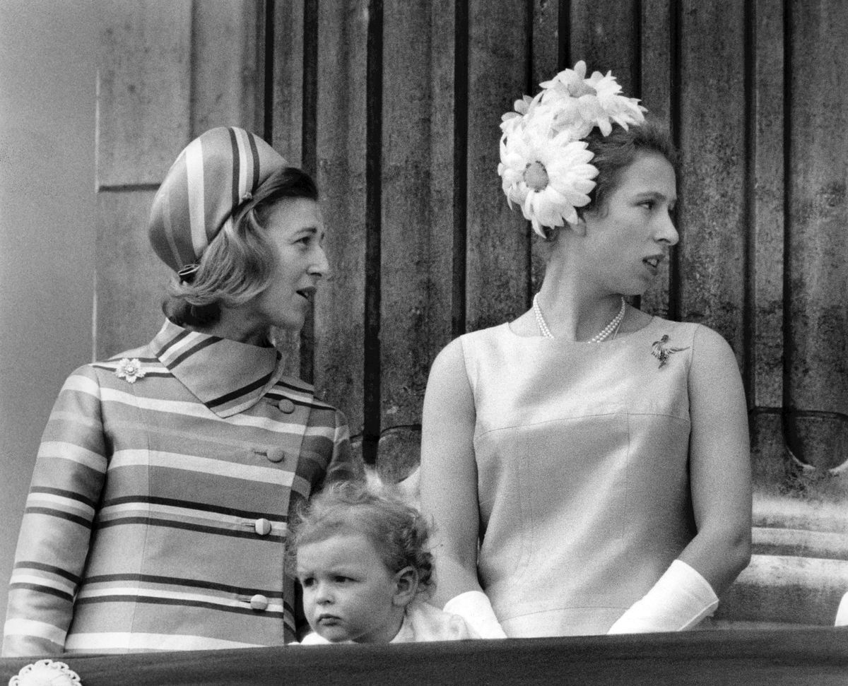 Princess Alexandra of Kent (L) and Princess Ann stand on the balcony at Buckingham Palace, on June 14, 1969 to watch the fly over of the Concorde following the Trooping of the colour ceremony. (Photo by CENTRAL PRESS / AFP)