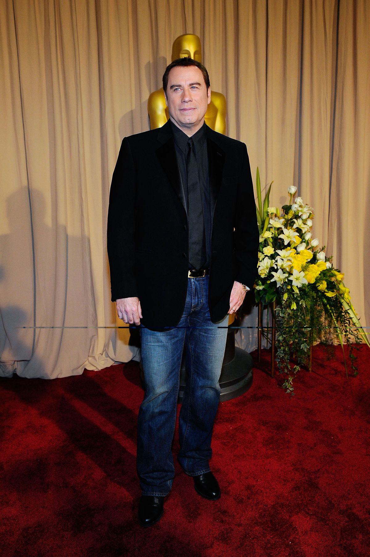 HOLLYWOOD - MARCH 07:  (EDITORS NOTE: NO ONLINE, NO INTERNET, EMBARGOED FROM INTERNET AND TELEVISION USAGE UNTIL THE CONCLUSION OF THE LIVE OSCARS TELECAST)  Actor John Travolta arrives backstage at the 82nd Annual Academy Awards held at Kodak Theatre on March 7, 2010 in Hollywood, California.  (Photo by Kevork Djansezian/Getty Images)