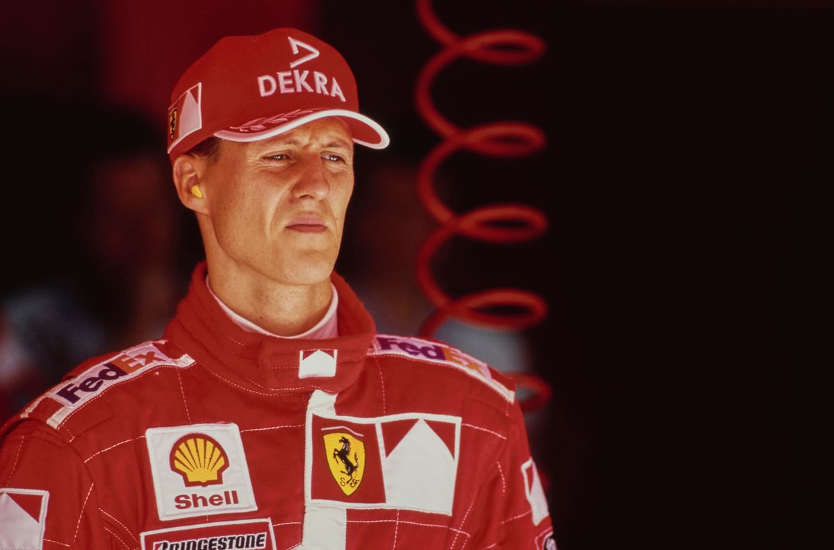 Portrait of Michael Schumacher from Germany, driver of the #3 Scuderia Ferrari Marlboro Ferrari F399 Ferrari V10 looks on from the pit garage during practice for the Formula One French Grand Prix on 26th June 1999 at the Circuit de Nevers-Magny Cours in Magny Cours, France. (Photo by Mark Thompson/Getty Images)