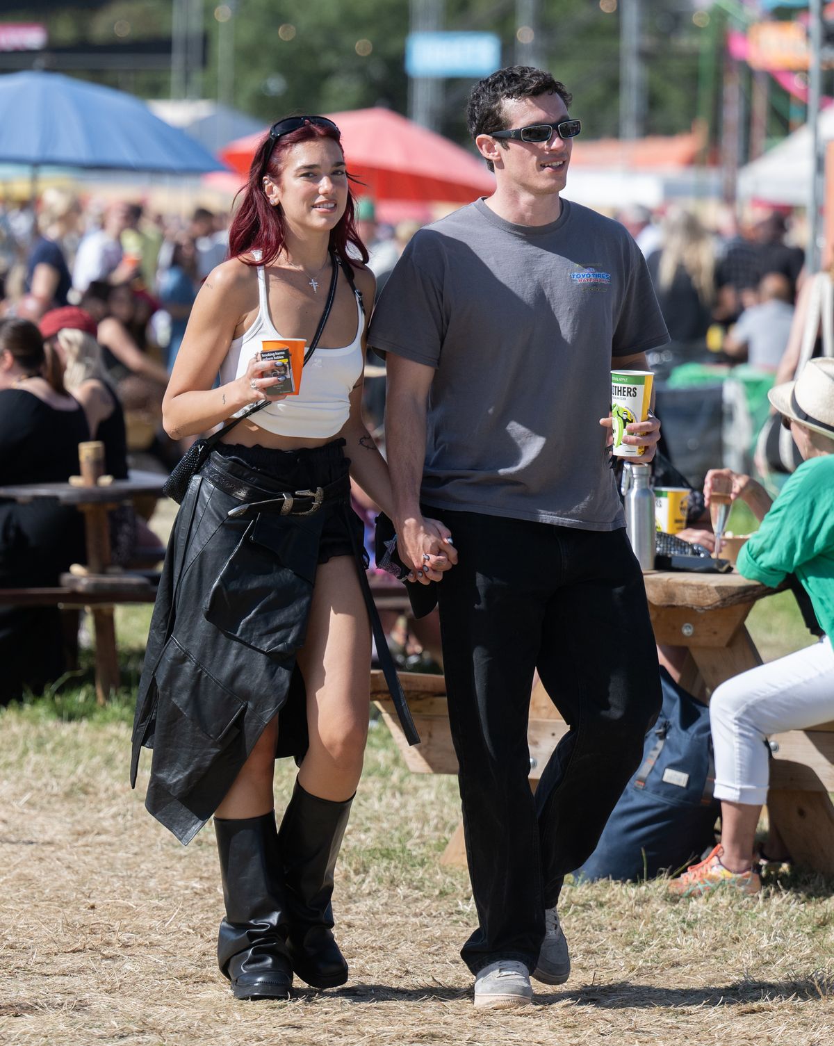 GLASTONBURY, ENGLAND - JUNE 29: Dua Lipa and Callum Turner during day four of Glastonbury Festival 2024 at Worthy Farm, Pilton on June 29, 2024 in Glastonbury, England. Founded by Michael Eavis in 1970, Glastonbury Festival features around 3,000 performances across over 80 stages. Renowned for its vibrant atmosphere and iconic Pyramid Stage, the festival offers a diverse lineup of music and arts, embodying a spirit of community, creativity, and environmental consciousness. (Photo by Samir Hussein/WireImage)