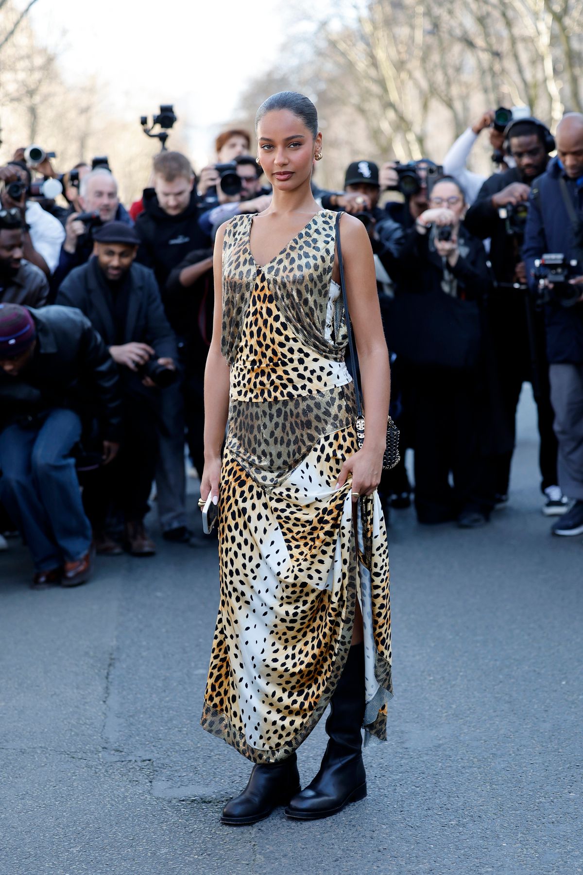 PARIS, FRANCE - MARCH 06: Jamilla Strand wears leopard print long dress, black boots, black Rabanne bag, outside Rabanne, during the Womenswear Fall/Winter 2025/2026 as part of Paris Fashion Week on March 06, 2025 in Paris, France. (Photo by Claudio Lavenia/Getty Images)