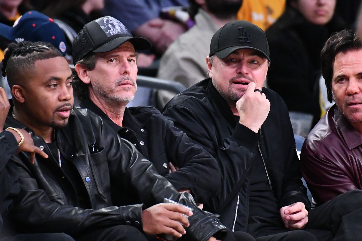 LOS ANGELES, CALIFORNIA - DECEMBER 23: Nas and Leonardo DiCaprio (R) attend a basketball game between the Los Angeles Lakers and the Detroit Pistons at Crypto.com Arena on December 23, 2024 in Los Angeles, California. NOTE TO USER: User expressly acknowledges and agrees that, by downloading and or using this photograph, User is consenting to the terms and conditions of the Getty Images License Agreement. (Photo by Allen Berezovsky/Getty Images)