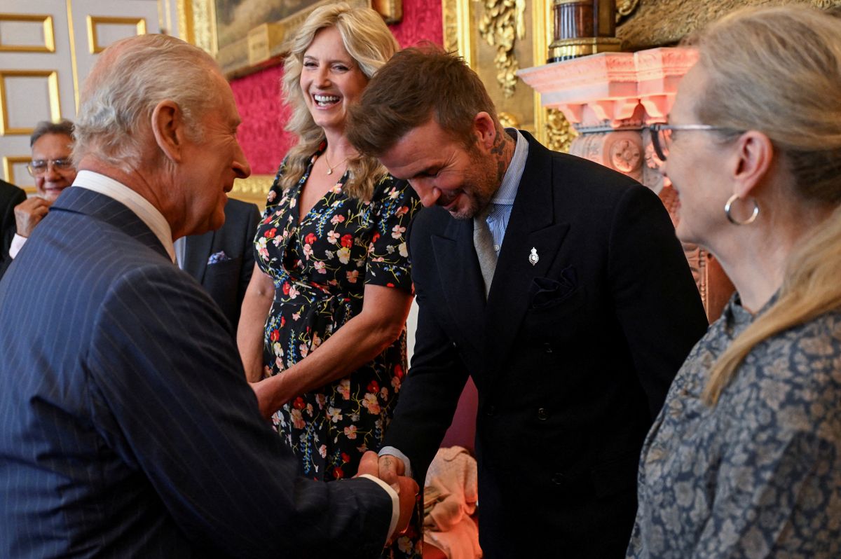 English former football player David Beckham (C) shakes hands with Britain's King Charles III (front L) during the King's Foundation Awards ceremony, on the 35th anniversary of The Kings Foundation, at St James's Palace, in London, on June 12, 2025. (Photo by Chris J RATCLIFFE / POOL / AFP)