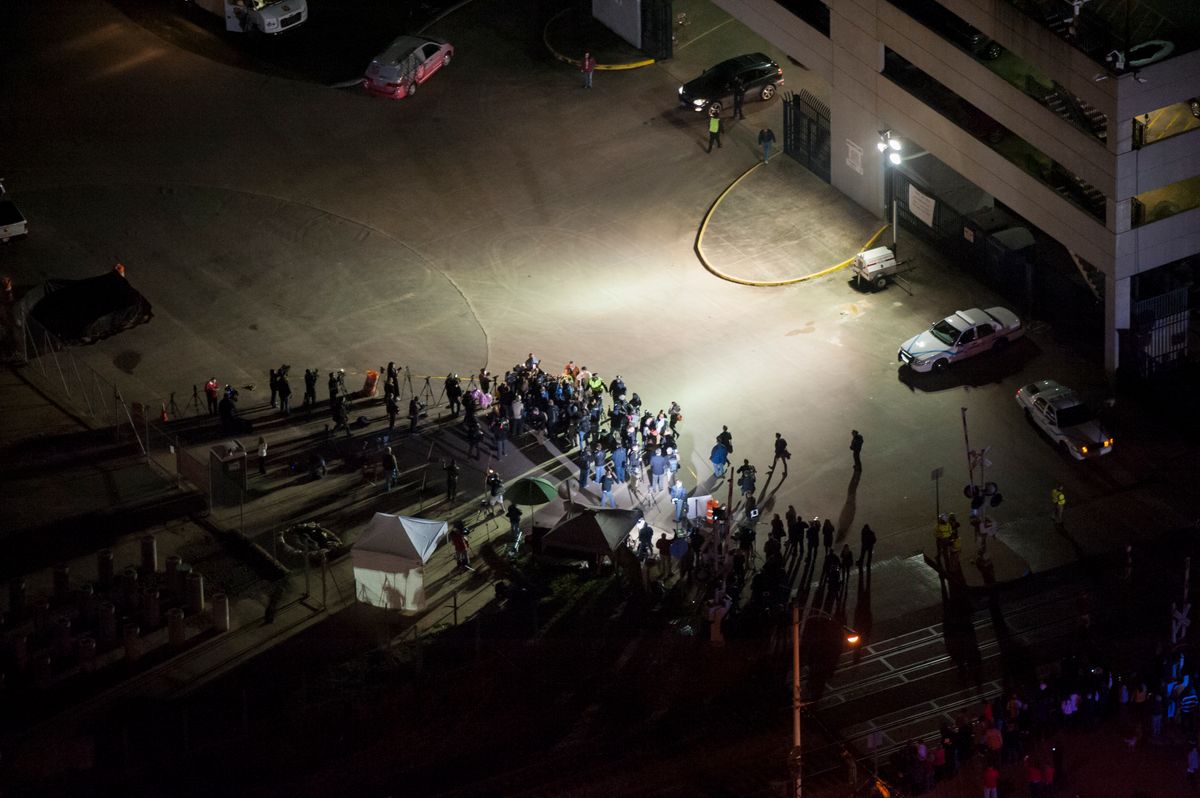 MOBILE, AL - FEBRUARY 14:  The media await the final unloading from the crippled cruise liner Carnival Triumph February 14, 2013 in Mobile, Alabama. An engine fire on February 10 left the ship and its 4,000 passengers without power and with scarce food. While people onboard reported toilets that wouldn't work, the ship was restocked with food during the days it was being towed through the Gulf of Mexico. According to reports, a few dozen people awaited the ship's arrival in Mobile, covered live by cable news network CNN.  (Photo by Jeff Gammons/Getty Images)