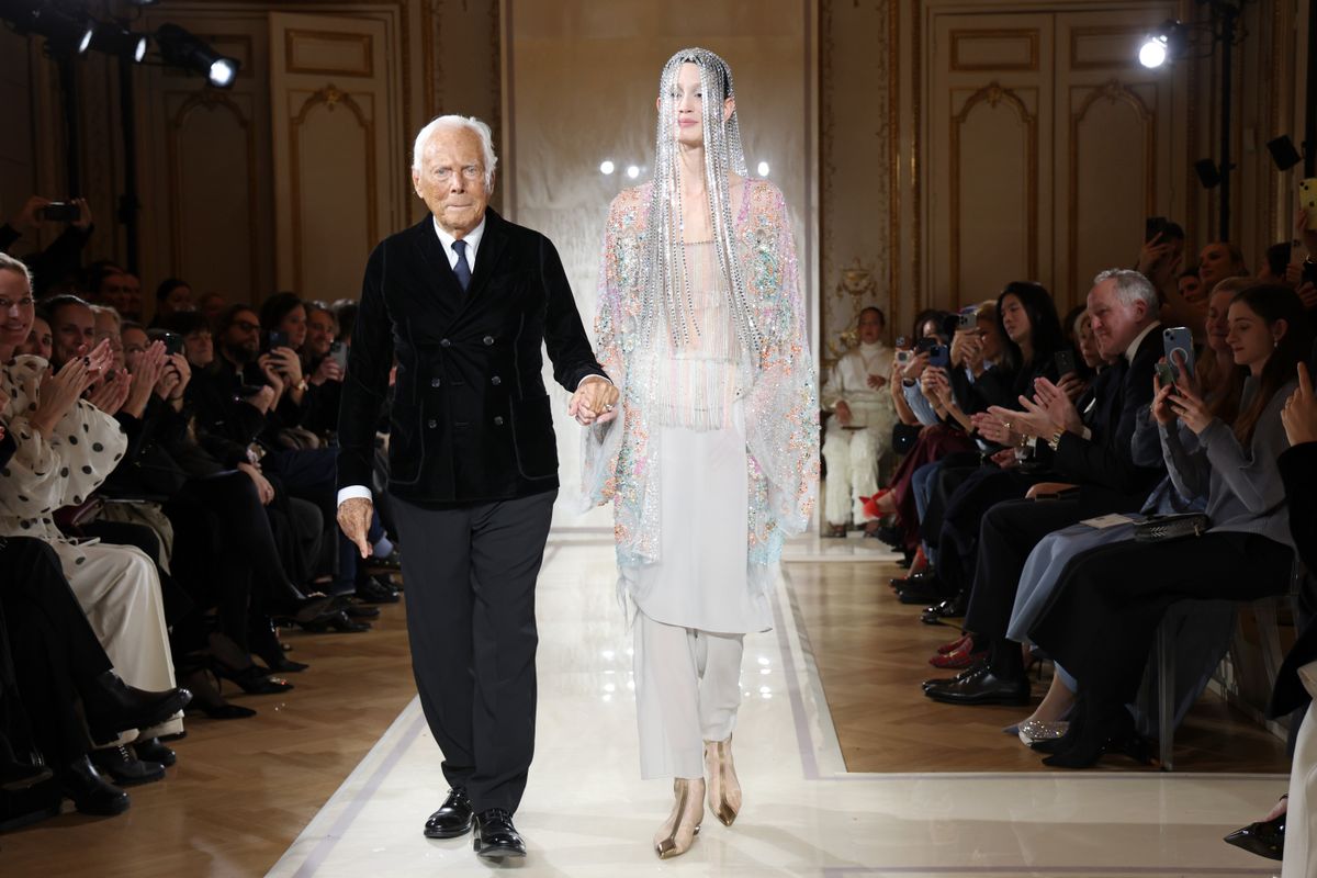 PARIS, FRANCE - JANUARY 28: (EDITORIAL USE ONLY - For Non-Editorial use please seek approval from Fashion House) Giorgio Armani (L)  acknowledges the applause of the audience   during the Giorgio Armani Privé Haute Couture Spring-Summer 2025 show as part of Paris Fashion Week on January 28, 2025 in Paris, France. (Photo by Pascal Le Segretain/Getty Images)