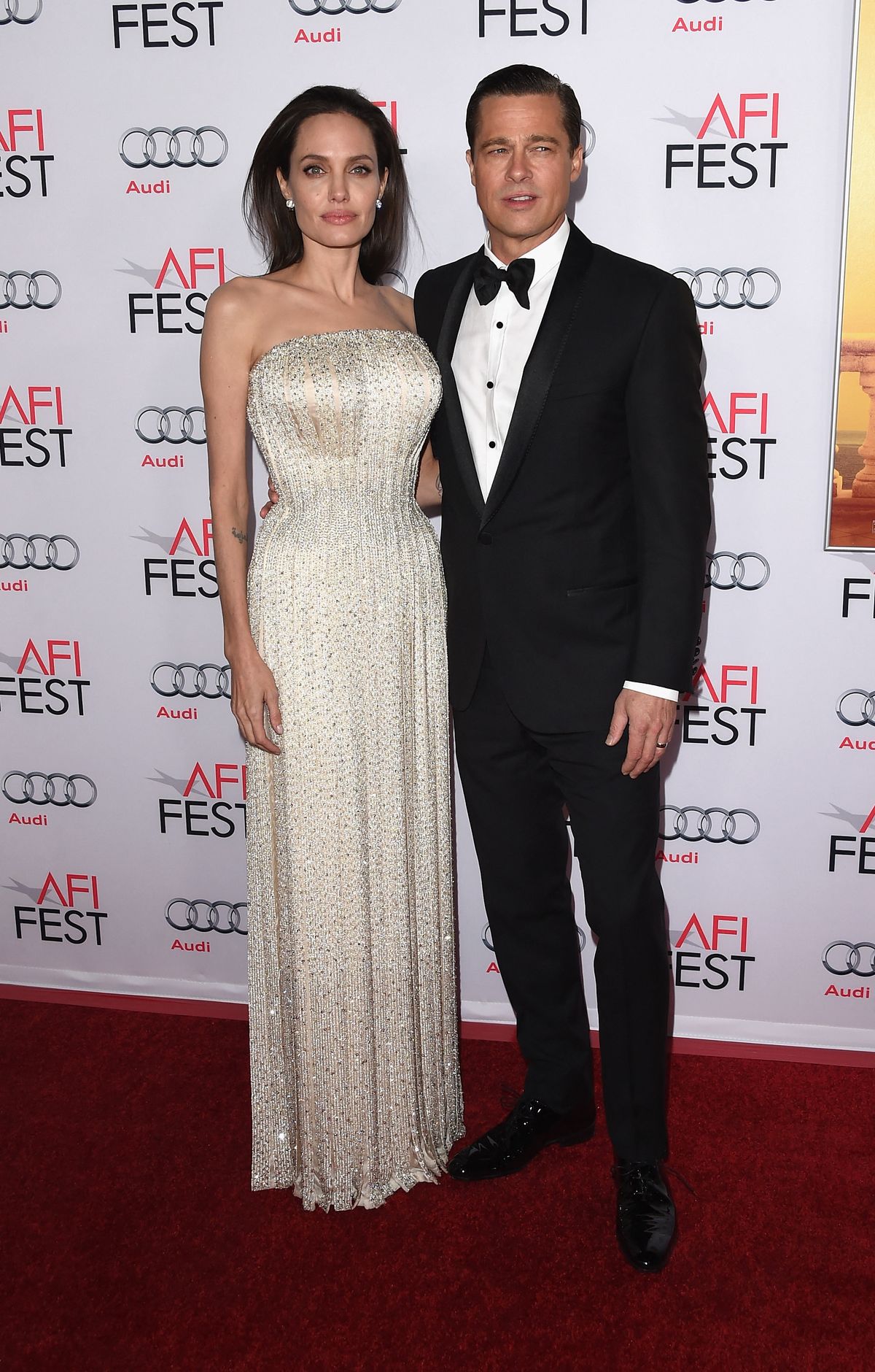 HOLLYWOOD, CA - NOVEMBER 05: Writer-director-producer-actress Angelina Jolie Pitt (L) and actor-producer Brad Pitt attend the opening night gala premiere of Universal Pictures' "By the Sea" during AFI FEST 2015 presented by Audi at TCL Chinese 6 Theatres on November 5, 2015 in Hollywood, California.   Jason Merritt/Getty Images/AFP (Photo by Jason Merritt / GETTY IMAGES NORTH AMERICA / Getty Images via AFP)