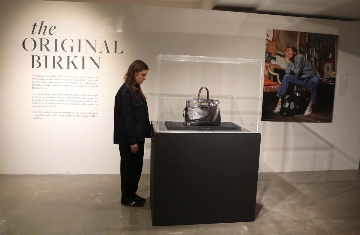 June 9, 2025, New York, New York, USA: A woman views Jane Birkinâ€™s Original Hermes Birkin Bag, crafted nearly forty years ago by the esteemed French fashion house Hermes, this all-black leather prototype, now known as The Original Birkin, laid the foundation for what would become the most iconic and sought-after handbag in the world.  seen during the press preview for Sothebyâ€™s Luxury Week June 2025 held at Sothebyâ€™s New York. (Credit Image: © Nancy Kaszerman/ZUMA Press Wire)