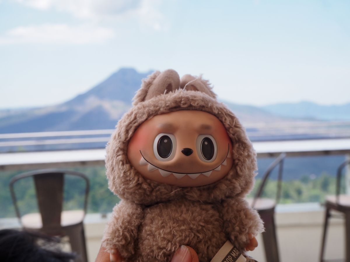 BALI - INDONESIA, 20-SEP-2024: Labubu doll with Mount Batur background in Bali