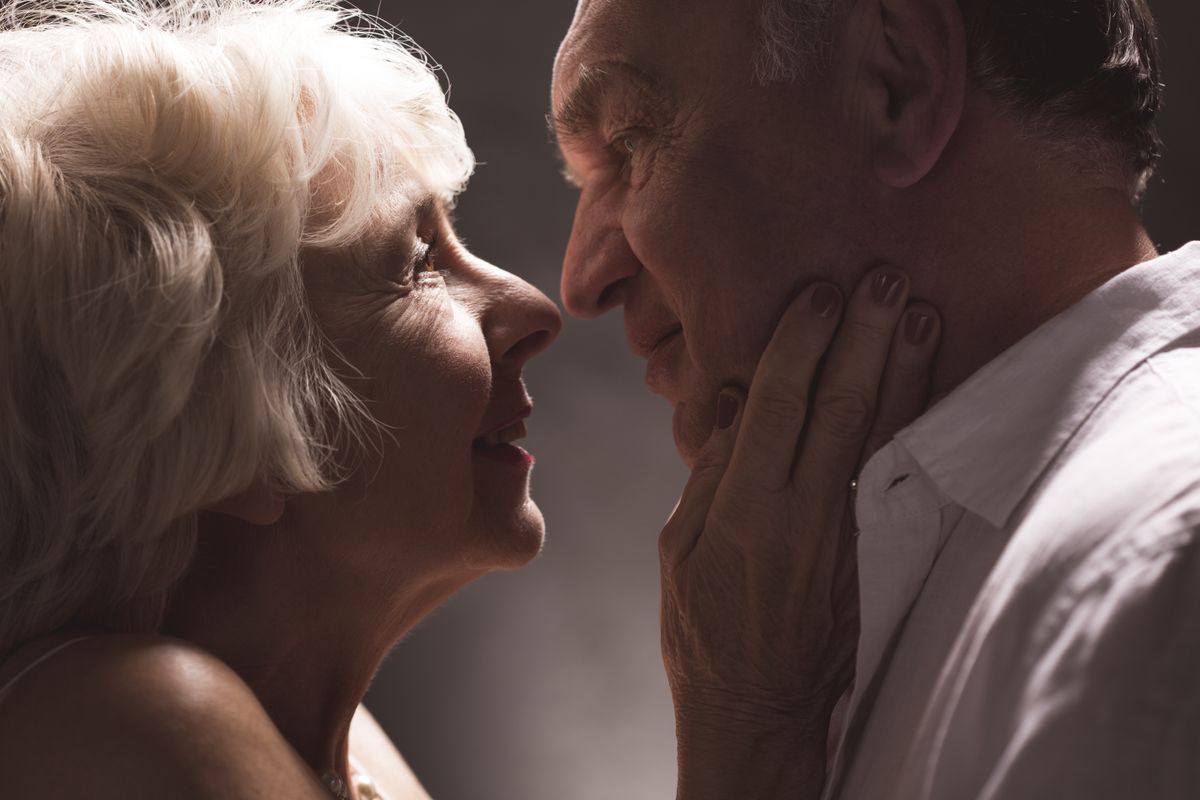 Erotic senior couple looking with passion  at eyes