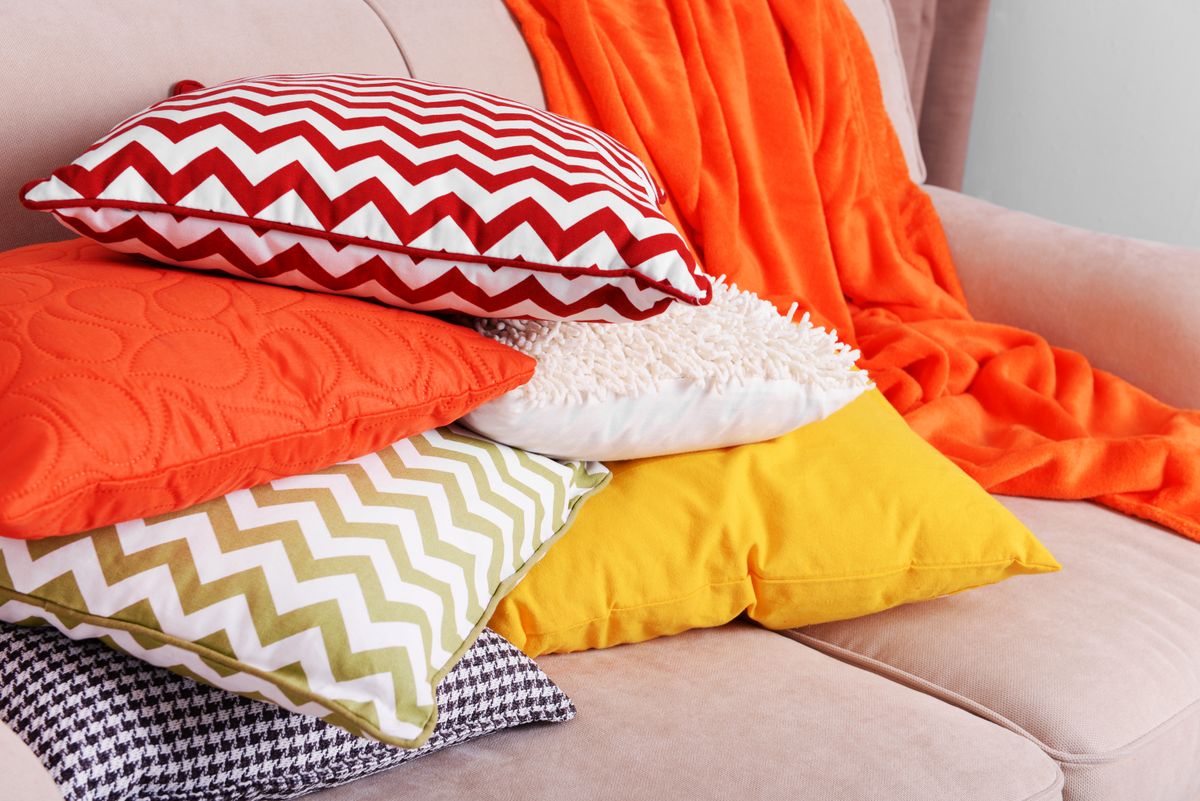 Colorful pillows on sofa close up