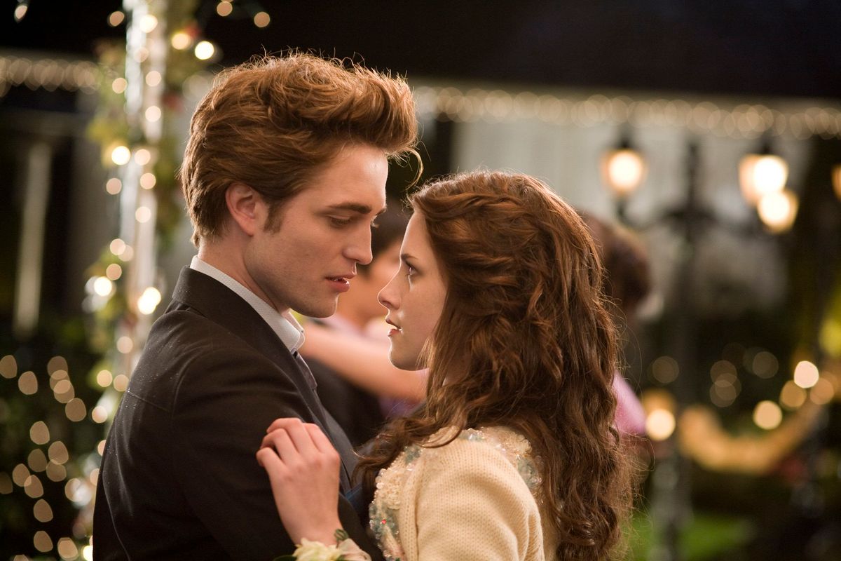 RELEASE DATE: November 21, 2008. MOVIE TITLE: Twilight. STUDIO: Maverick Films. PLOT: Bella Swan has always been a little bit different. When her mother remarried and Bella chooses to live with her father in the rainy little town of Forks, Washington, she didn't expect much of anything to change. But things do change when she meets the mysterious and dazzlingly beautiful Edward Cullen. In no time at all, they are swept up in a passionate romance - unorthodox because Edward really isn't like the other boys. He can stop a moving car with his bare hands. Oh, and he hasn't aged since 1918. Like all vampires, he's immortal. PICTURED: KRISTEN STEWART as Bella Swan and ROBERT PATTINSON as Edward Cullen
