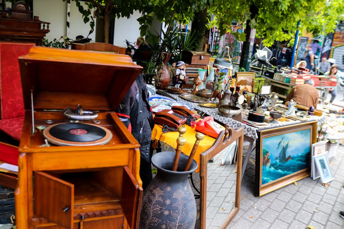 Athens, Greece - November 07, 2021 Famous Monastiraki flea market. On Avissinas Square, there are a number of antique dealers and second hand dealers offering antiques, silverware and leather goods