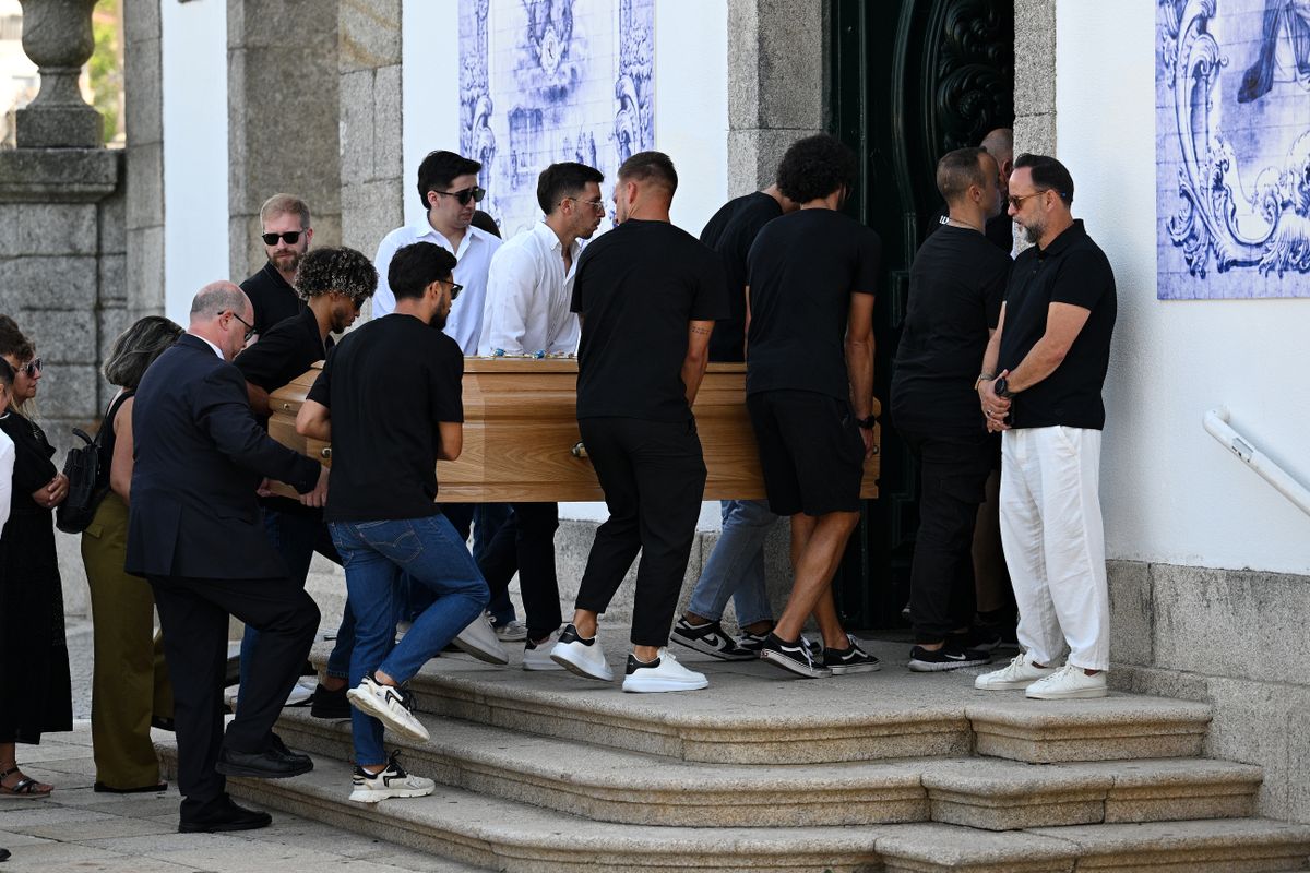 GONDOMAR, PORTUGAL - JULY 05: The Coffins of Diogo Jota And Andre Silva are carried by family, former teammates and friends into the Church at a funeral held for Diogo Jota and his brother Andre Silva at Igreja Matriz de Gondomar on July 05, 2025 in Gondomar, Portugal. Diogo Jota was a professional football player for Liverpool FC and the Portuguese national team, while Andre Silva played for FC Penafiel in Portugal's second tier. The brothers died in a car accident in the province of Zamora, Spain, on July 3. (Photo by Octavio Passos/Getty Images)