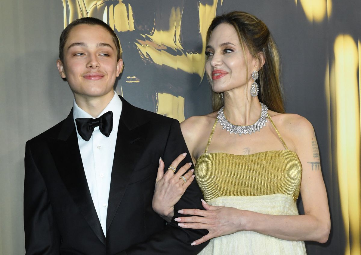 US actress Angelina Jolie and her son Knox Jolie-Pitt arrive for the Academy of Motion Picture Arts and Sciences' 15th Annual Governors Awards at the Ray Dolby Ballroom in Los Angeles on November 17, 2024. (Photo by VALERIE MACON / AFP)