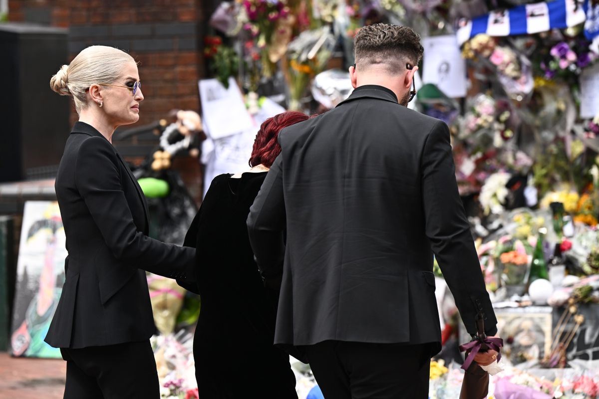 BIRMINGHAM, ENGLAND - JULY 30: (L-R) Kelly Osbourne, Sharon Osbourne and Jack Osbourne arrive to view tributes to the late Ozzy Osbourne from fans as his funeral cortege travels through his home city of Birmingham on July 30, 2025 in Birmingham, England. The Black Sabbath frontman passed away on July 22nd at the age of 76. His death occurred just a little over two weeks after his final live performance at the 'Back to the Beginning' concert in his hometown of Birmingham. (Photo by Leon Neal/Getty Images)
