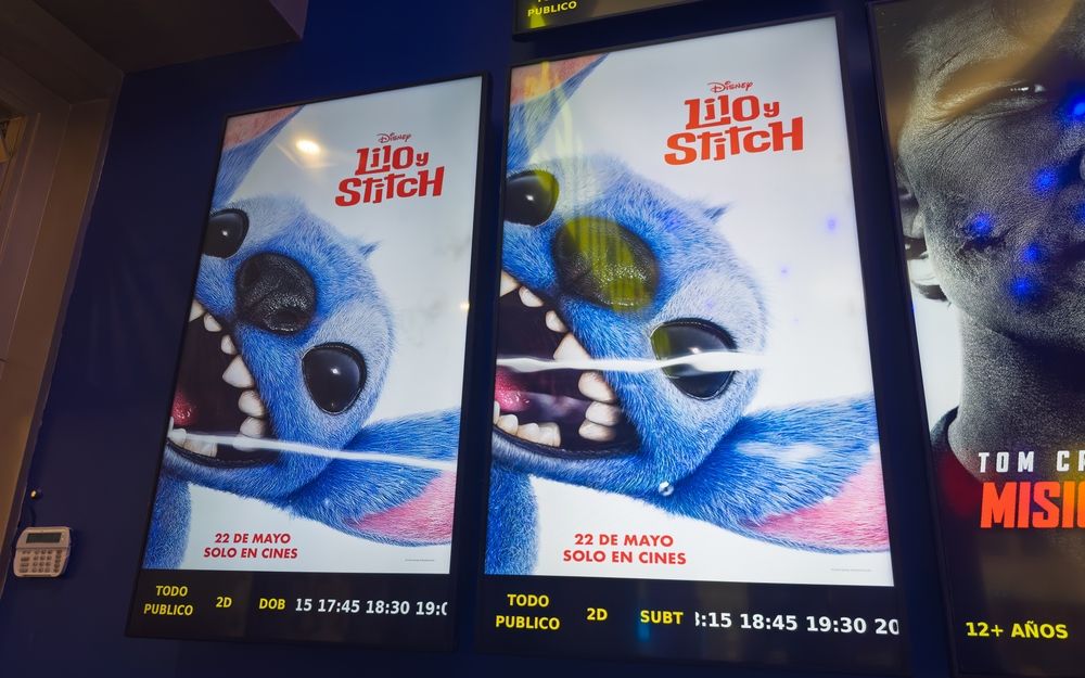 Guayaquil, Ecuador – May 17, 2025: Posters of Disney’s new “Lilo y Stitch” film displayed at a local cinema ahead of its official release, reflecting the global impact of remakes in the film industry