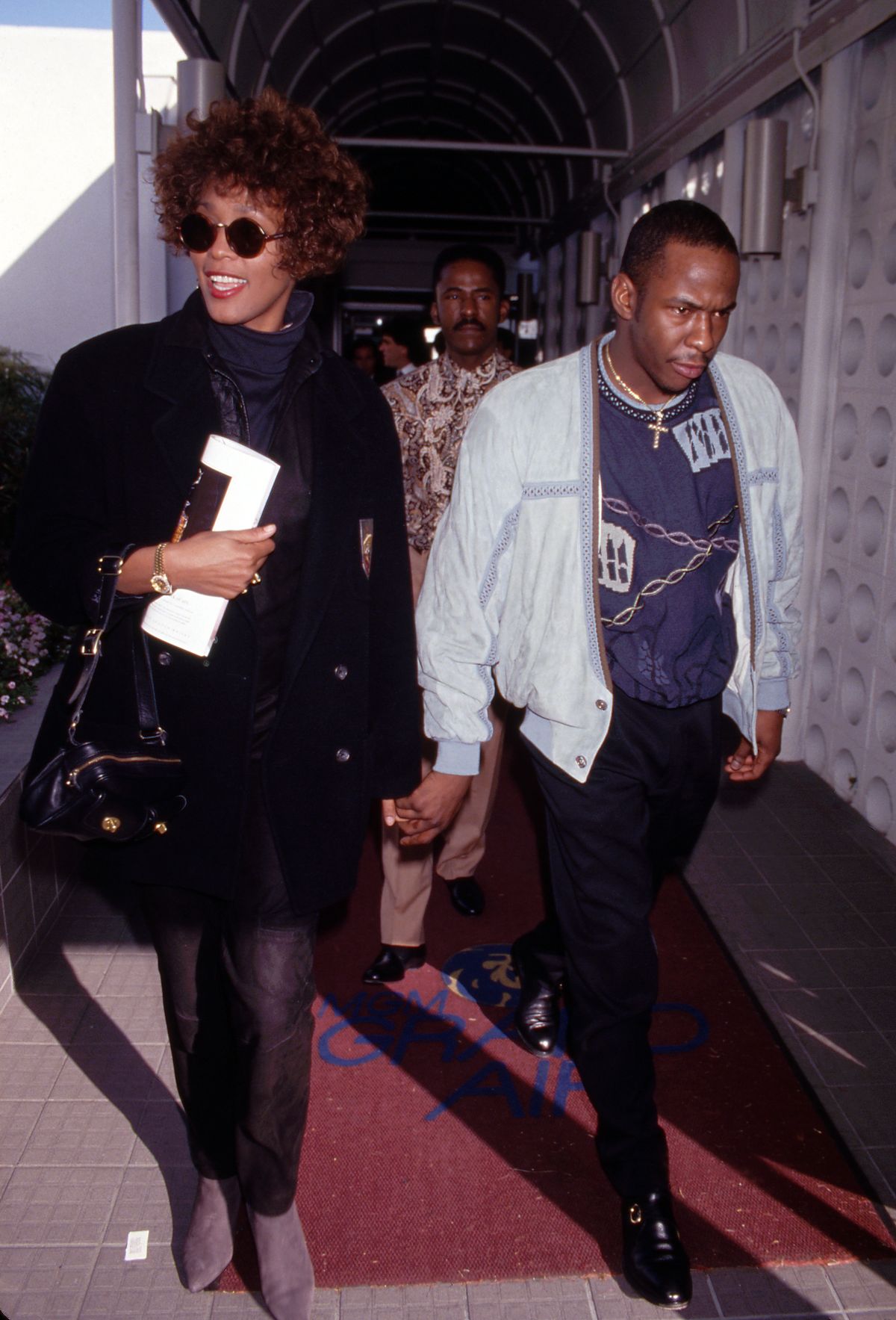 Whitney Houston and Bobby Brown  on October 1991 at Los Angeles International Airport in Los Angeles, California. (Photo by Ralph Dominguez/MediaPunch via Getty Images)